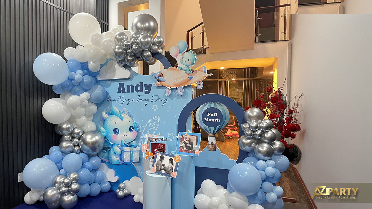 Backdrop thôi nôi bé Andy với tên bé nổi bật và hoa tươi trang trí tinh tế