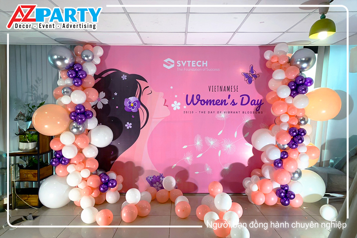 backdrop có điểm nhấn là hình ảnh người phụ nữ kết hợp line bóng cam, trắng